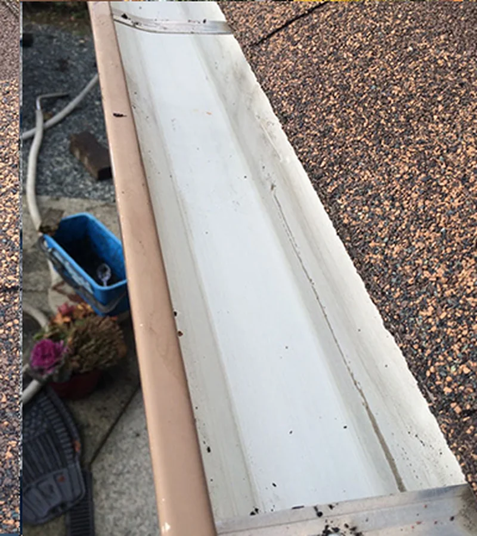 Gutter cleared and flushed by Mr. Sparkle